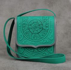 The perfect accessory for the stylish woman who loves to make a statement - our unique green leather crossbody bag! This purse crafted from premium 4mm genuine calf leather and embossed with a striking design. The emerald hue adds a pop of color to any outfit, making it the ideal choice for those who love to stand out from the crowd. Whether you're treating yourself or searching for a special 3rd anniversary gift, this original and colourful bag is sure to please. Upgrade your accessory game with this eye-catching green purse today! In addition to the one big compartment, there are pockets in the bag: - 1 internal zip-pocket; - 1 button pocket, e.g. for cell phone or keys. Dimensions: 22x20x8 cm / 8.3x7.9х3.1 inch Strap length 140 cm / 55 inch Please note! Since every item in my store is h Purse Crafts, Everyday Purse, 3rd Anniversary Gifts, Ladies Bag, 3rd Anniversary, Green Purse, Purse For Women, Colorful Bags, Outfit Making