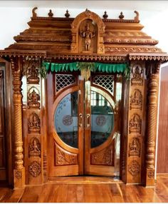 an ornate wooden door with green curtains