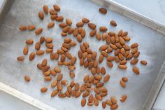 almonds on a baking sheet ready to be cooked in the oven for roasting