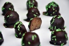 there are many chocolates with green sprinkles on them