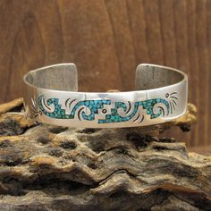 "Sterling silver southwest cuff bracelet. The design is done with chip inlay turquoise. The inside measures 6 1/8\" including the 7/8\" opening. B B is stamped inside (Benson Boyd Navajo). The bracelet weighs 21g. The bracelet is pretty and in good condition. Thank you for looking. Please let us know if you have questions. BCLT-586K-BT-13 k *The color on your screen may not reflect the actual stone color due to variations in monitors*" Southwestern Turquoise Cuff Bracelet With Inlay, Southwestern Style Turquoise Cuff Bracelet With Inlay, Tucson Az, Silver Turquoise, Turquoise Sterling Silver, Tucson, Cuff Bracelet, Stone Color, Cuff Bracelets