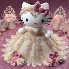 a hello kitty figurine in a dress with roses