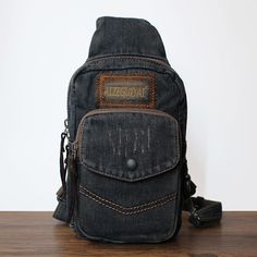 Overview： Design: Blue Denim Mens Cool Sling Bag Chest Bag Vintage Denim Sling Bag For Men In Stock: Ready to Ship (2-4 days)Include: Only BagCustom: NoColor: Dark Blue, BlackLeather:, Denim, Measures: 24cm x 15cm x 10cm Weight: 0.35kgSlots: 1 zipper slot, 1 phone slot, 1 back slot,Accessories(option): NoneStyle: Blue Denim Mens Cool Sling Bag Chest Bag Vintage Denim Sling Bag For MenVery durable (At least 5 Years) and it should last a life time Description: Introducing the Denim Sling Bag: a st Denim Sling Bag, Mens Sling Bag, Sling Bag For Men, Overview Design, Commute To Work, Sling Bags, Timeless Accessories, Vintage Inspired Design, Bag Vintage