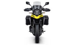 the front end of a yellow and black motorcycle on a white background with no people