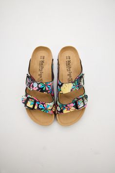 Introducing Maibulun's Signature Double Strap Footbed Sandal in tropical multi floral prints. Designed for ultimate comfort and style, these sandals feature a double strap design for secure support and a hard footbed for extra ankle support. Perfect for a day out or a casual stroll, elevate your look with these signature sandals. 0.59" inch heel Slip-on / buckle closure Hard Cushioned footbed Man-made leather upper Man-made lining EVA sole Footbed Sandals, Ankle Support, Eva Sole, Strap Design, Elevate Your Look, Leather Upper, Floral Prints, Slip On, Buckle