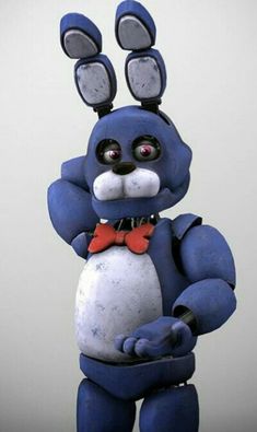 a blue and white toy with two ears on it's head is standing in front of a gray background