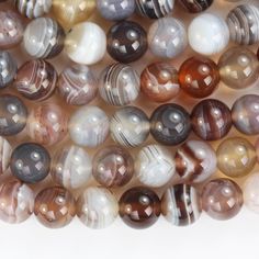 multicolored agate beads are stacked on top of each other