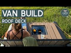 a woman sitting on top of a wooden deck next to a small grill and water bottle