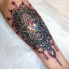 a tattoo with an intricate design on the leg