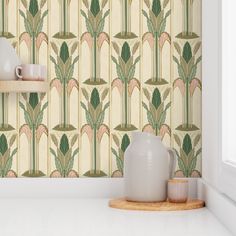 a white shelf with two vases on top of it next to a wall paper