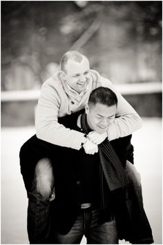 a man carrying another man on his back