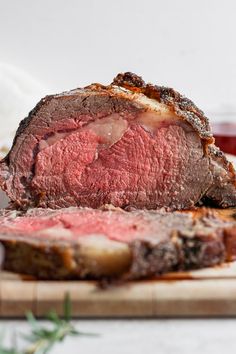 a piece of roast beef on a cutting board