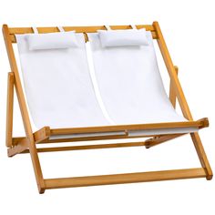 a wooden chair with two white sheets on it's back and the seat folded down