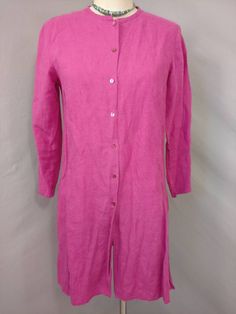 "Soft surface and rich color on this vintage linen tunic shirt jacket. The label is Eileen Fisher, fabric content 100% linen. Photographed un ironed. Natural slightly nubby linen surface, mid weight, color is a wonderful dark magenta pink - not quite as bright/ florescent looking as it photographed. Shape is slim tunic style with a skinny band collar and button front all the way down, deep side slits & long sleeve. Size is marked XS, shown on a 6mannequin, please go by measurements. Machine Long Sleeve Linen Dress With Buttons For Work, Button-up Tunic For Daywear, Long Sleeve Tunic With Buttons For Daywear, Spring Button-up Tunic With Buttons, Spring Linen Tunic With Buttons, Long Sleeve Linen Dress With Buttons For Spring, Single Breasted Long Sleeve Linen Top, Fall Linen Button-up Dress, Long Sleeve Linen Dress With Pockets