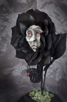 a black rose with white face and red eyes