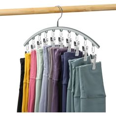 a rack with pants hanging from it's hooks