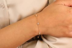 Diamond by the Yard Bracelet / .15ct - .25ct - .40ct - .60ct / White Full Cut Genuine Diamonds / 14k Solid Gold Diamond Bracelet / Must Have! Length of Chain Between Bezels: 0.80 inch A Diamonds by the Yard Bracelet is a must-have in any jewelry box! It goes with absolutely everything and makes any outfit look complete. Wear alone, or stack with other bracelets, it's as versatile as it is classic. ✔ Handmade ✔ Solid Gold ✔ Genuine Diamonds ✔ It has 5 diamond bezels. Dimensions and Diamond weight Delicate Wedding Ring, Diamond By The Yard, Diamonds By The Yard, Gold Diamond Bracelet, Bezel Ring, Bracelets Gold Diamond, Bezel Diamond, Wedding Bracelet, Eternity Ring