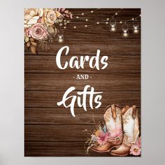 a wooden sign that says cards and gifts with boots on the front, surrounded by flowers