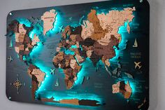 the illuminated map of the world is mounted to the wall