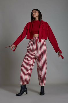 "ABOUT THE GARMENTThis set features a smocked racer back top, striped RE pants, and a shuffle jacket. These pieces are made in hand-woven cotton. The wide-leg pants are comfortable with elastic detailing at the back and come with pockets too. The top is made with smocked fabric and is cut in style to fit perfectly. Style the pieces together for an edgy look or style it separately for a more casual look. (set of 3)Mati is a Sustainable and Ethical clothing, slow fashion designer brand from India, Striped Pant, Open Jacket, Open Sleeve, Smocked Top, Work Party, Ethical Clothing, Edgy Look, Colourful Outfits, Cotton Jacket