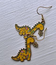 Floral Dinosaur Earrings Cute Dino Earrings for Gift Idea - Etsy Playful Metal Jewelry For Gifts, Playful Metal Jewelry Gift, Playful Metal Jewelry As A Gift, Fun Nickel-free Metal Jewelry, Handmade Fun Metal Jewelry, Fun Handmade Metal Jewelry, Fun Gold Dangle Jewelry, Novelty Gold Earrings, Gold Dangle Fun Jewelry