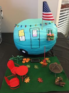 a table topped with an inflatable blue trailer