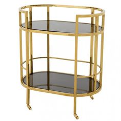 a gold metal and glass side table on wheels