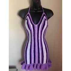 a purple and white crochet swimsuit on a mannequin