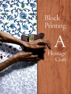 two hands holding a piece of wood with the words block printing heritage craft on it