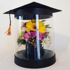 a graduation cap with flowers in it