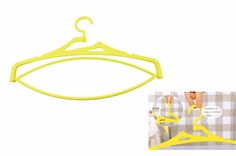 a pair of yellow hangers next to a photo of a person's feet