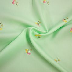 Edith is a mint green lyocel fabric with embroidered floral pattern, ideal for tops, blouses, shirts, dresses, skirts or trousers. Composition: 100% LYOCELL Width: 142cm Colour: mint green, multicolour (flowers) Pattern: floral Weight: 190gr/m2 Spring Silk Tops With Resham Embroidery, Silk Tops With Resham Embroidery For Spring, Green Silk Fabric With Floral Embroidery, Silk Top With Chikankari Embroidery For Spring, Spring Embroidered Green Blouse, Green Embroidered Silk Tops, Green Silk Blouse With Floral Embroidery, Green Silk Fabric With Chikankari Embroidery, Green Tops With Resham Embroidery For Spring