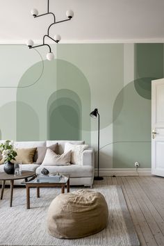 A green abstract arches wallpaper from HappyWall Wallpaper Drawing Room Ideas, It Office Wall Design, Wallpapers In Living Room, Green Mural Painting, Monochromatic Accent Wall, Living Room Accent Wallpaper, Salon Wall Colors Ideas, Wallpaper Living Room Accent Wall Ideas, Wallpapers For Living Room Interiors