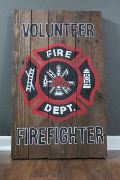 a wooden sign that says volunteer fire department