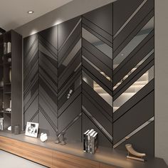 a modern living room with black and white wallpaper on the walls, wooden shelves and bookshelves