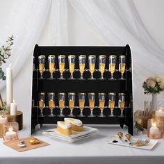 a table topped with lots of glasses filled with champagne