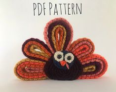 a crocheted turkey sitting on top of a white table next to the words free pattern