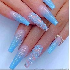 blue stiled nails with flowers and pearls on the tip are perfect for this manicure