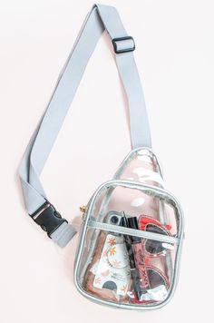 This sling backpack is the perfect blend of practicality and style. Made with clear PVC material, it’s lightweight, durable, and has a zipper closure, so you can easily find what you’re looking for inside. Perfect for stadiums, concerts, and anywhere you will need a clear bag for security.Features:Clear BagSilver & Clear Sling BagZipper closureAdditional Front PocketAdjustable Strap Everyday Mesh Bags With Clear Strap, Daily Use Mesh Bags With Clear Strap, Backpack With Clear Strap For Everyday Use, Everyday Backpack With Clear Strap, Everyday Use Backpack With Clear Strap, Clear Crossbody Shoulder Bag With Zipper, Clear Crossbody Shoulder Bag With Zipper Closure, Clear Mesh Travel Bag, Functional Clear Bags For Everyday Use