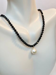 Beautiful choker necklace with freshwater Pearl and natural Black spinel gemstones Beautiful and Classic look. Perfect gift for any occasion Holidays, Birthday or just something nice as a gift for her. Everyday choker necklace for girls, mommy and daughter gift idea, Valentine's Day gift ◈ Handmade to order ◈ Freshwater pearl: about 9.5x12mm ◈ Black spinel: 4mm natural gemstone round shape, sparkle as much as black diamond ◈ 14k gold filled claps and one inch extension free USA shipping A little Elegant Faceted Beaded Necklaces For Everyday, Elegant Black Beaded Necklace With Pearl Charm, Elegant Faceted Beaded Necklace, Black Beaded Necklace With Pearl Charm As Gift, Black Beaded Necklaces With Pearl Charm Gift, Gift Black Beaded Necklaces With Pearl Charm, Elegant Crystal Necklace With Black Beads For Gift, Elegant Black Beaded Crystal Necklace For Gift, Elegant Black Single Strand Crystal Necklace