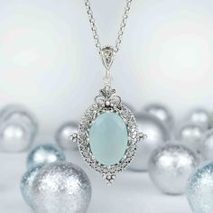 Indulge in the serene beauty of aqua blue chalcedony with this handcrafted filigree art pendant necklace. A stunning 13x18mm faceted oval cut gemstone takes center stage in this exquisite piece, delicately set in silver. The pendant's height of 1.90 inches and width of 1.05 inches make it the perfect statement piece for any outfit. The silver chain measures 20 inches in length, making it the ideal length to rest just below the collarbone. This pendant necklace is the perfect gift option for spec Aqua Chalcedony, Art Pendant, Sterling Silver Filigree, Oval Pendant, Blue Chalcedony, Silver Filigree, Silver Chain Necklace, Silver Necklaces, Silver Chain