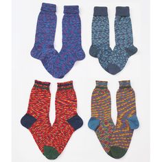 four pairs of socks with different patterns on them