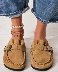 Details

Style No. 81224263; Color Code: 111

So effortless for a laid back look, these hand-stitched mules feature soft suede uppers with a moccasin-inspired construction and a buckle detail.

Features: Slip-on style, backless design, suede uppers, hand-stitched mocc stitching, round toe, buckle detail, lined footbed, rubber outsole

Why We <3 It: Made with great care and love, the mocc seam stitch is hand-stitched and each pair is hand-lasted, making the shape and execution vary with hand-touched charm.

FP Collection

Artisan crafted from fine leathers and premium materials, FP Collection shoes, bags and belts are coveted for their signature vintage Business Casual Shoes Women Clogs & Mules, Free People Calabasas Clog, Slip On Shoes Clogs & Mules, Trending Womens Shoes Clogs & Mules, Suede Mules, Backless Design, Layered Jewelry, Macadamia, Soft Suede