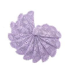 a purple crocheted flower on a white background