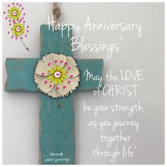 a cross with flowers on it and the words happy anniversary blessing, may the love of christ be your strength as you journey together through life