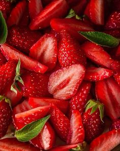 fresh strawberries with green leaves on the top are ready to be cut into wedges