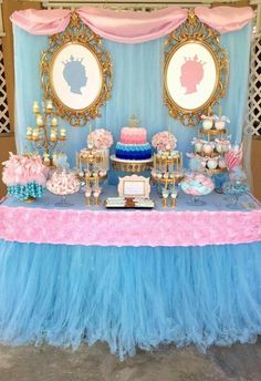 a blue and pink dessert table at a princess birthday party