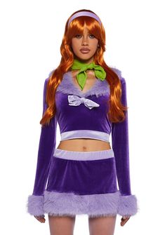 a woman in a purple and green costume with long red hair wearing a bow tie