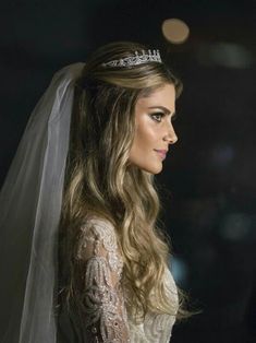 a woman wearing a veil and tiara