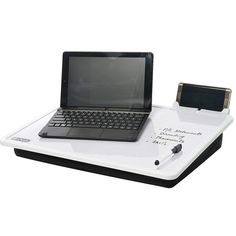 an open laptop computer sitting on top of a white tray